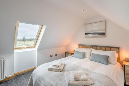 a bedroom with a bed with two towels on it at 2 Bed in Hatton oc-t32765 in Peterhead