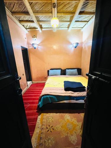 a bedroom with a bed in a small room at riad imlil in Imlil