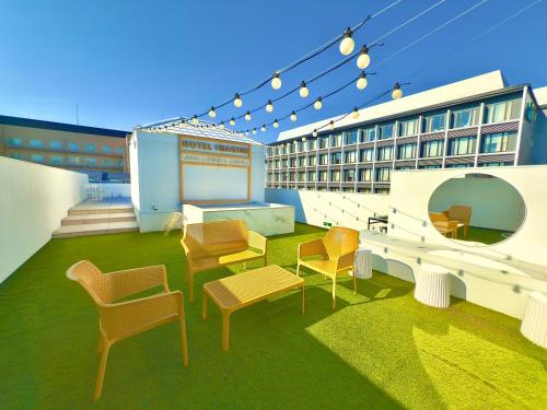 a group of chairs and tables on top of a building at Hotel Imagine Kyoto in Kyoto