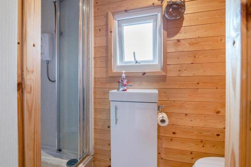 a small bathroom with a toilet and a window at 1 Bed in Cross oc-s29656 in Axbridge