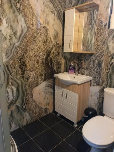 a bathroom with a sink and a toilet at Theodora Hostel in Istanbul