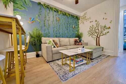 a living room with a couch and a table at Garden Street Retreat - 15 Minutes to NYC in Hoboken