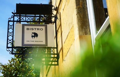a sign on the side of a building at Cotswold House Hotel and Spa - "A Bespoke Hotel" in Chipping Campden