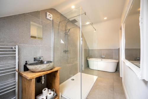 a bathroom with a sink and a shower and a tub at 1 Bed in Richmond oc-93264 in Richmond