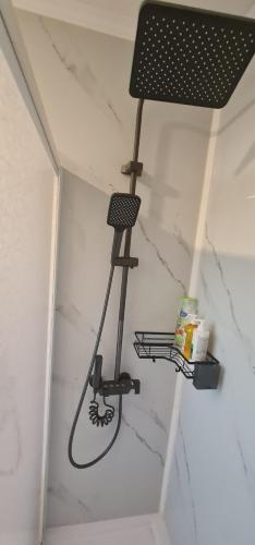a microphone hanging from the ceiling of a room at Cabañas Bio Bio Osorno in Osorno