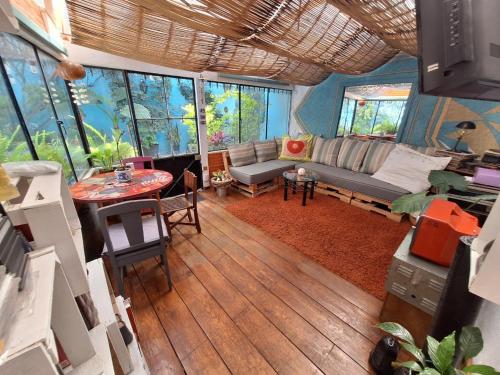 a living room with a couch and a table at Punto DF - Airport in Mexico City