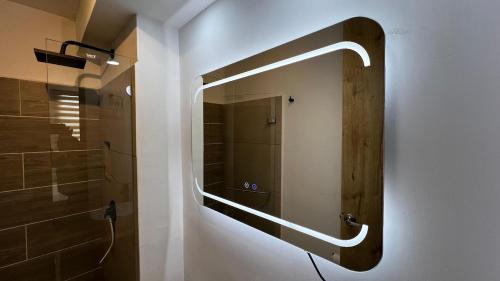 a bathroom with a mirror and a towel rack on the wall at Posada del Quindío 0812 in Armenia