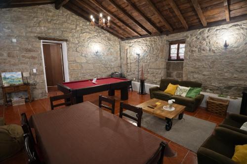 a living room with a ping pong table at Casa da Pipela in Santo André