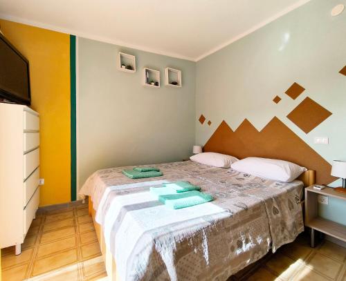 a bedroom with a large bed in a room at Casa Bonifacio in Scalea