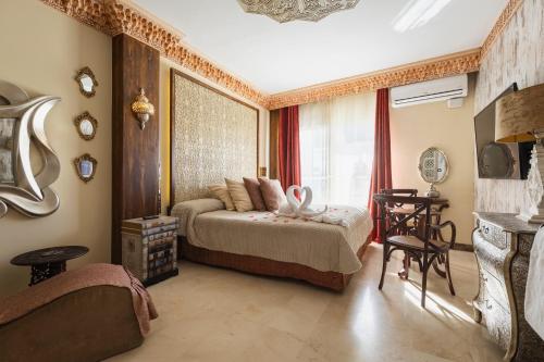 a bedroom with a bed and a window at Hotel Sun Palace Albir & Spa in Albir