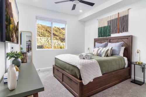 a bedroom with a bed and a ceiling fan at Sunny Springs, Hurricane, Ut in Hurricane