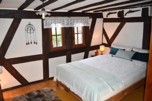 Giường trong phòng chung tại Das Pautzen Haus