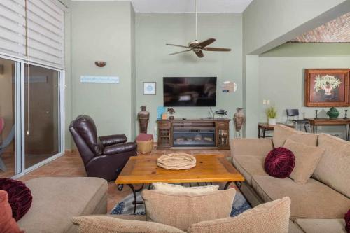 a living room with a couch and a table at Spacious Beachfront Condo Las Palmas II 11A in Puerto Peñasco
