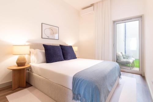 Elegant 2BR w Patio by LovelyStay