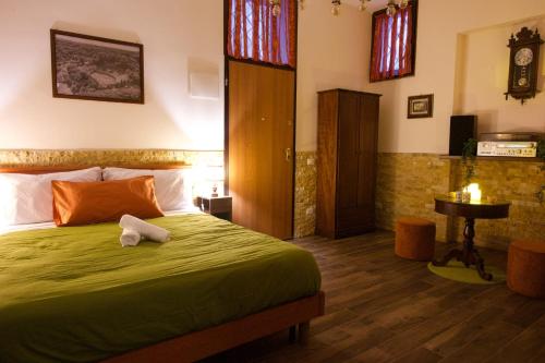 a bedroom with a bed with a towel on it at Casa Vacanze Dolce Angelo in Sutri