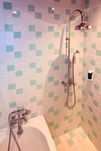 a bathroom with a shower and a sink at Le Petit Hôtel in Saint-Jean-de-Luz