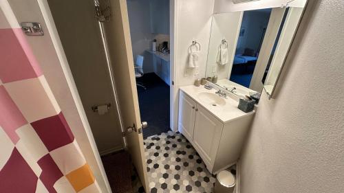 a bathroom with a sink and a mirror at Steps from UCLA Westwood 1 Bd 1Ba in Los Angeles