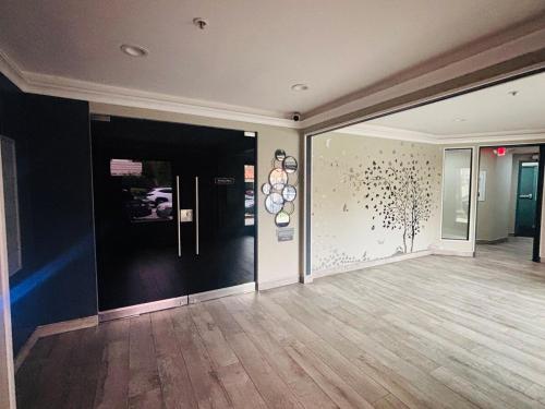 a room with a hallway with a wall with spheres on it at Steps from UCLA Westwood 1 Bd 1Ba in Los Angeles