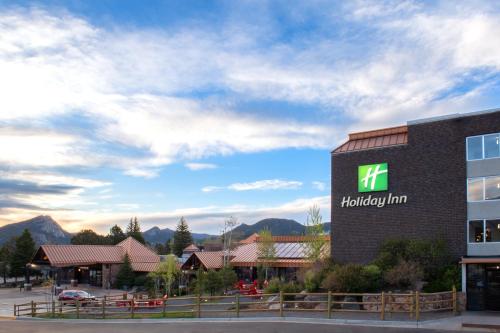 a hotel with a sign on the side of a building at Holiday Inn Estes Park by IHG in Estes Park