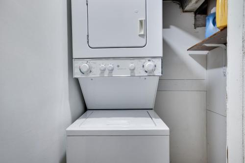 a white washer and dryer in a room at 4BR Newark Stay w/ Parking And Fast Wi-Fi in Newark