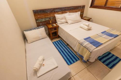 an overhead view of a bedroom with two beds at Delphin Beach Hotel - Suíte 238 in Guarujá
