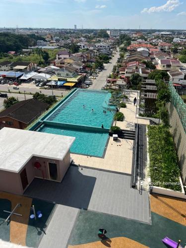 an overhead view of a swimming pool in a city at Cloud9 Homestay D Aman Residence in Alor Setar