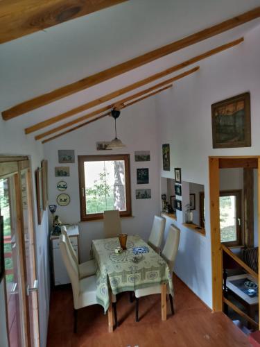 a dining room with a table and chairs at ZegZug apartman in Pankasz