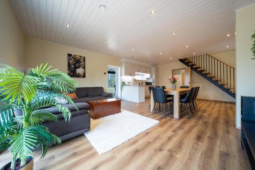 a living room with a couch and a table at Ninase Villa in Ninaze