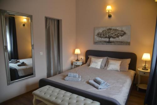 a bedroom with a bed with two towels on it at Casa Providenca in Kaštelir