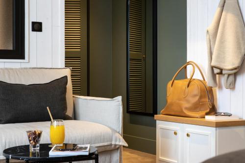 a living room with a couch and a coffee table at Le Celtique & Spa in Carnac