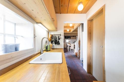 a bathroom with a tub and a sink in a room at Chalet Němčice in Němčice