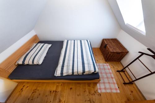 a small room with a bed in the attic at Chalet Němčice in Němčice