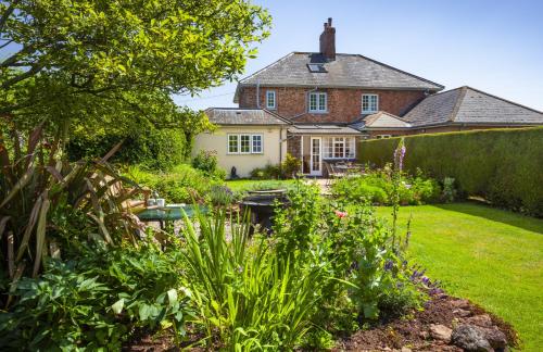 a house with a garden in front of it at Jacobs Pond Monksilver in Stogumber