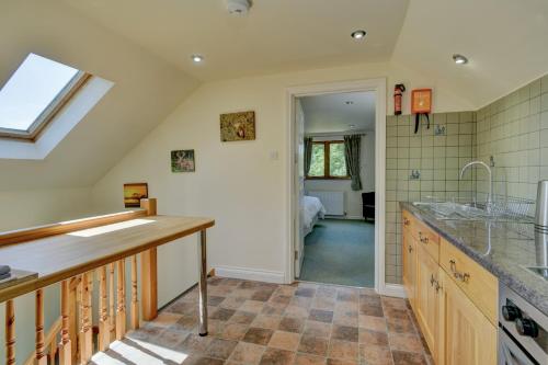 a kitchen with a sink and a counter top at Dunkery View Wootton Courtenay in Minehead