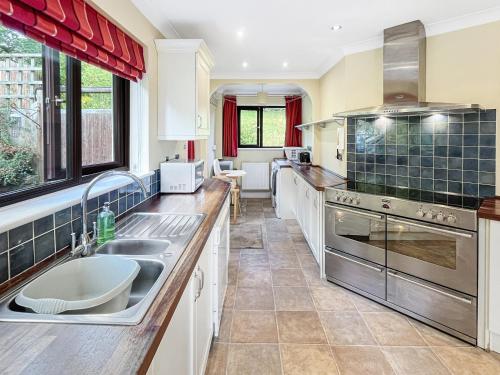 a kitchen with a sink and a counter top at Merrijig Dulverton in Dulverton