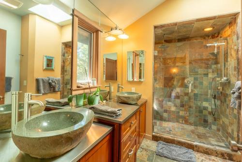 a bathroom with a large sink and a shower at Lighthouse in Little River