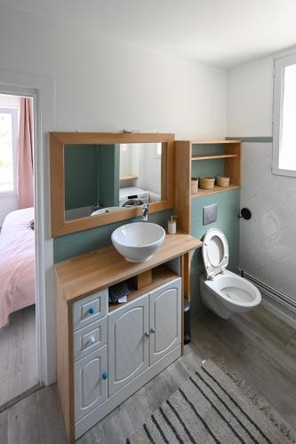 a bathroom with a sink and a toilet at La Belle Droite in Le Havre