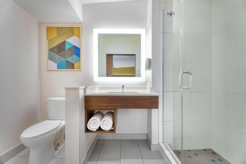 a bathroom with a sink and a toilet and a shower at Hotel Z - Gaslamp San Diego in San Diego