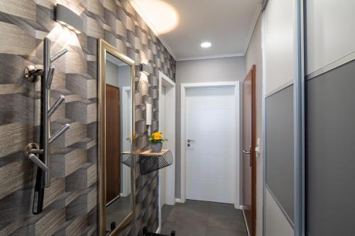 a hallway with a brick wall and a door at Apartment Enjoy in Büsum
