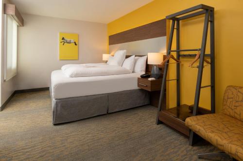 a hotel room with a bed and a chair at Hotel Z - Gaslamp San Diego in San Diego