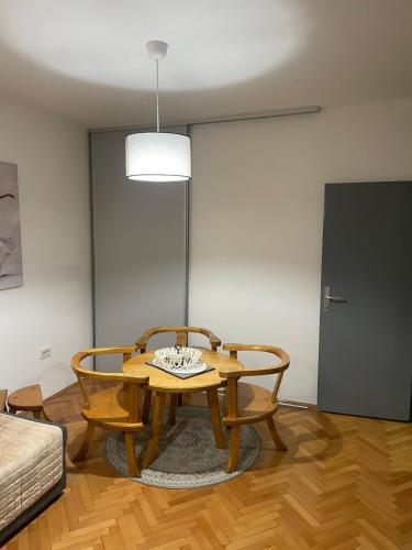 a living room with a table and two chairs at Apartments Ciki in Podgorica