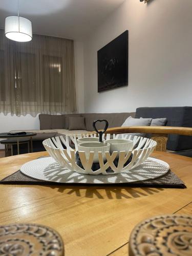 a large bowl on a table in a living room at Apartments Ciki in Podgorica