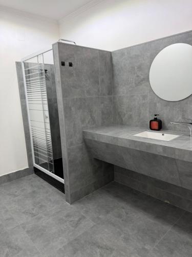 a bathroom with a sink and a mirror at Hotel MARSO in Almaty