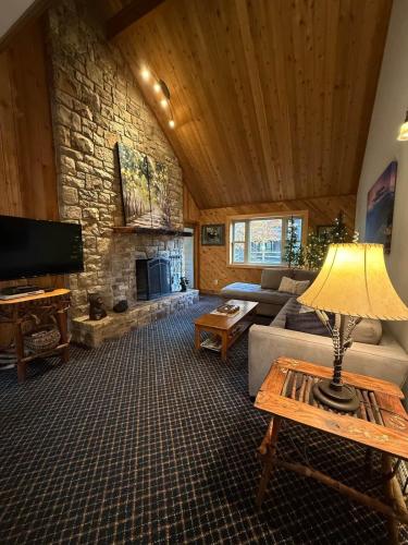 a living room with a couch and a fireplace at Effortless access to ski slopes•Endless relaxation in Beech Mountain