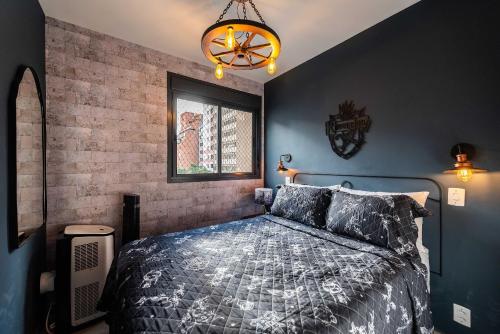 a bedroom with a bed and a brick wall at Immersive Hogwarts Experience – HP in São Paulo
