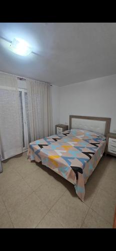a bedroom with a large bed in a room at Mediterraneo in Peniscola