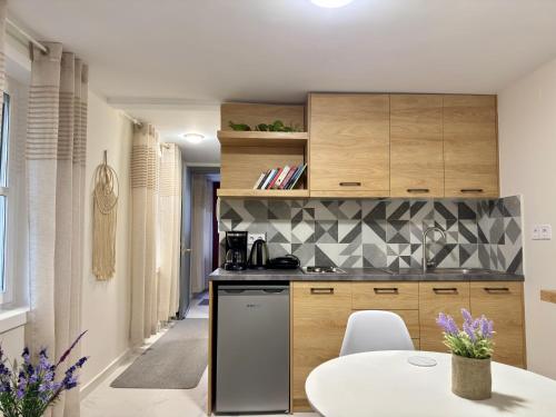 a kitchen with a table and a counter top at The Central Retreat 2 in Mytilene