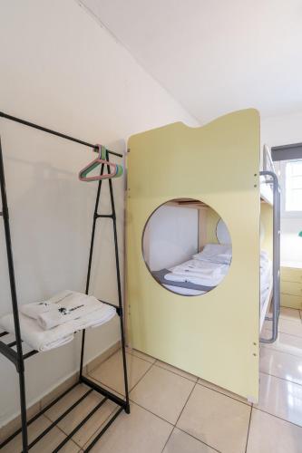 a room with a small room with a mirror at Zafeiris House in Kalívia Thorikoú