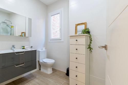 a bathroom with a toilet and a sink at The Art Flat in Figueres