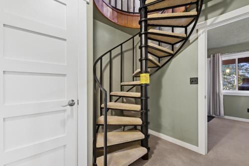 a spiral staircase in a home with a round ceiling at Moose Tracks in Whitefish